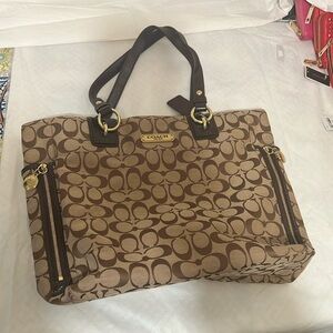 Gently used brown logo Coach bag.